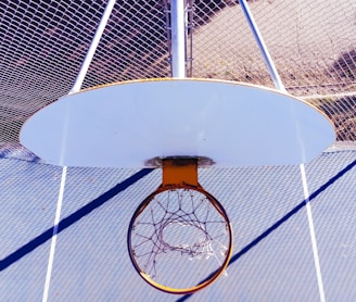 white and orange basketball hoop during day