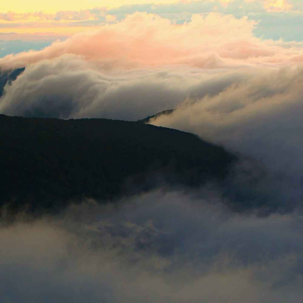 mountain covered by clouds