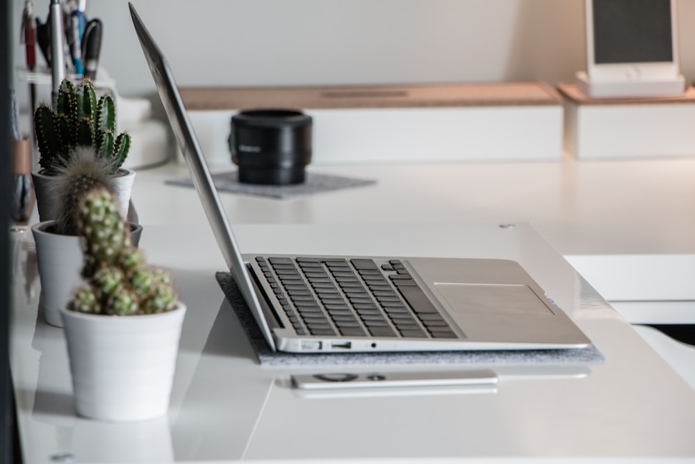 gray laptop computer open on table