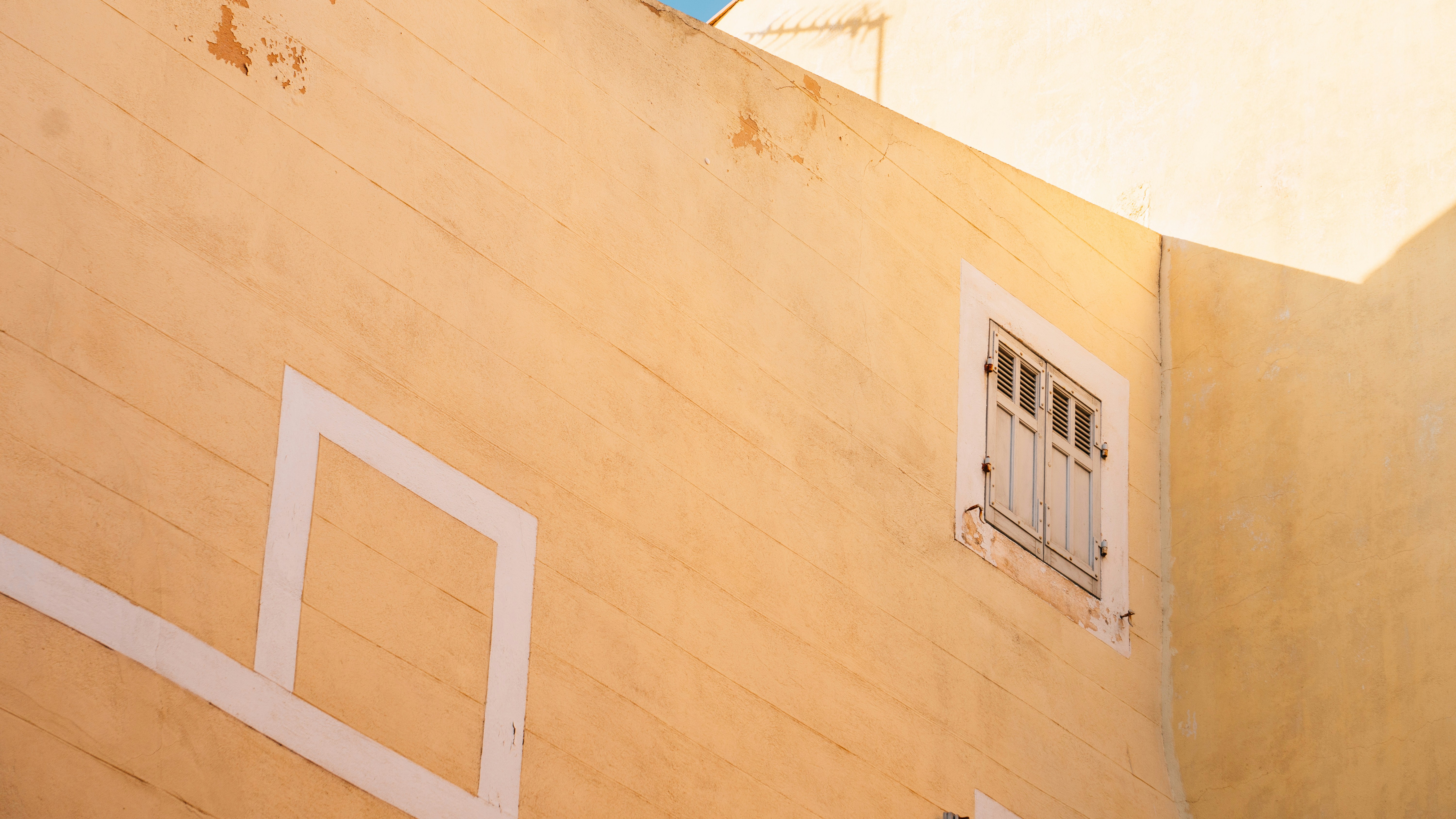 low angle photography of beige concrete building