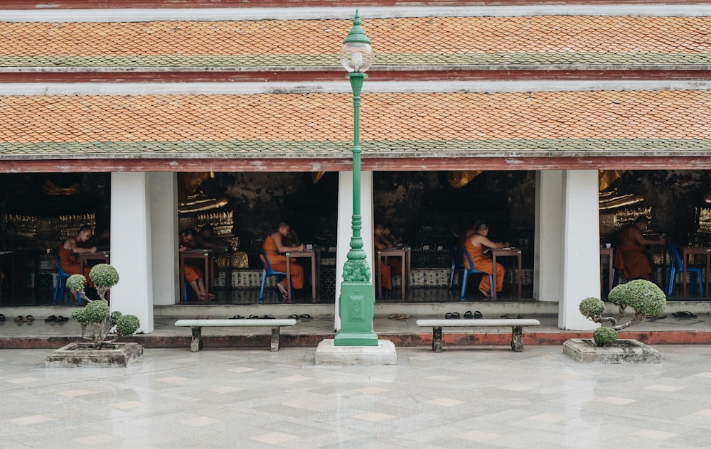 people sitting on chairs inside building