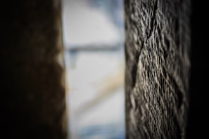 Close-up of a smooth cement burnt wall with subtle texture and warm lighting