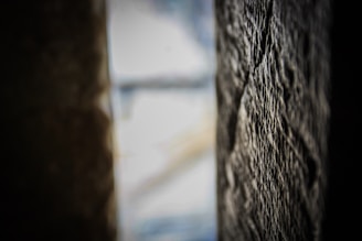 Close-up of a smooth cement burnt wall with subtle texture and warm lighting