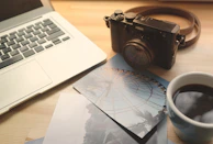 A serene desk corner with a photo frame showing a memorable past event and a cup of coffee.