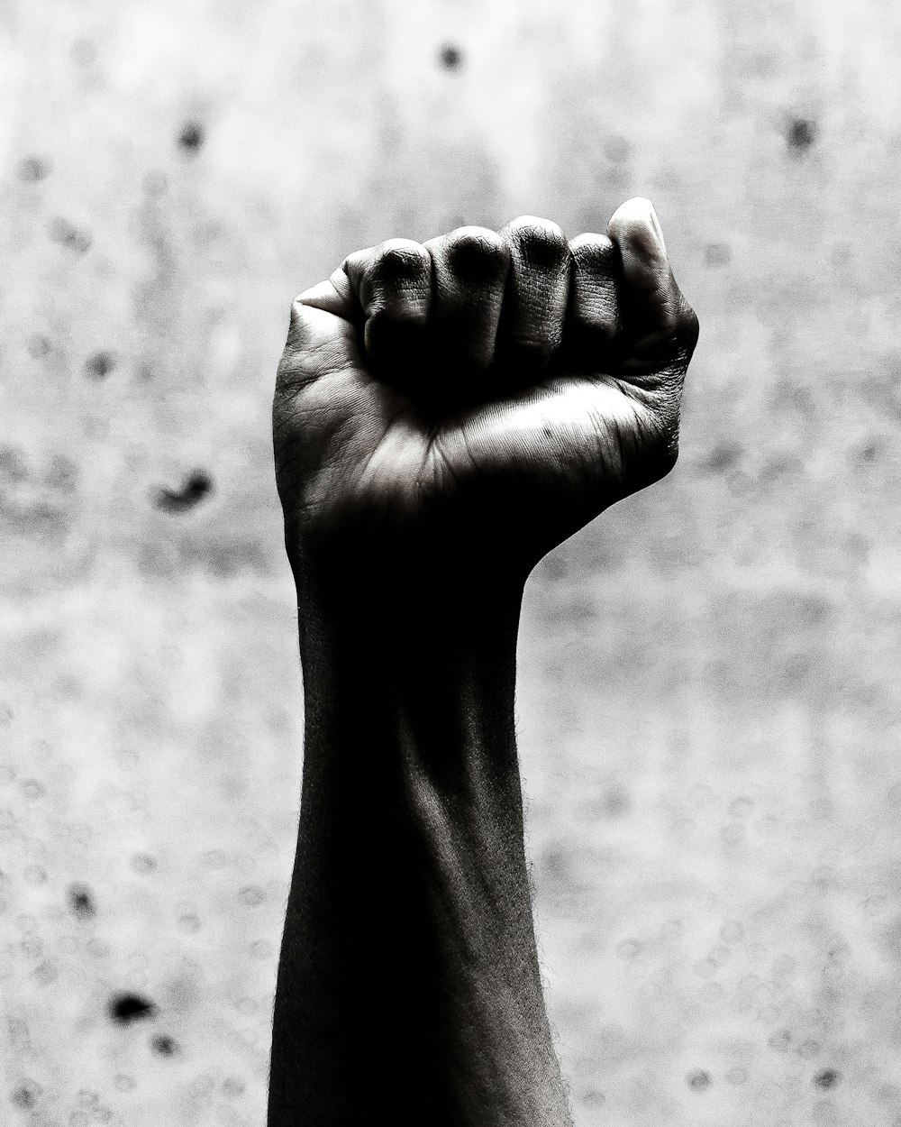 person's right fist grayscale photography