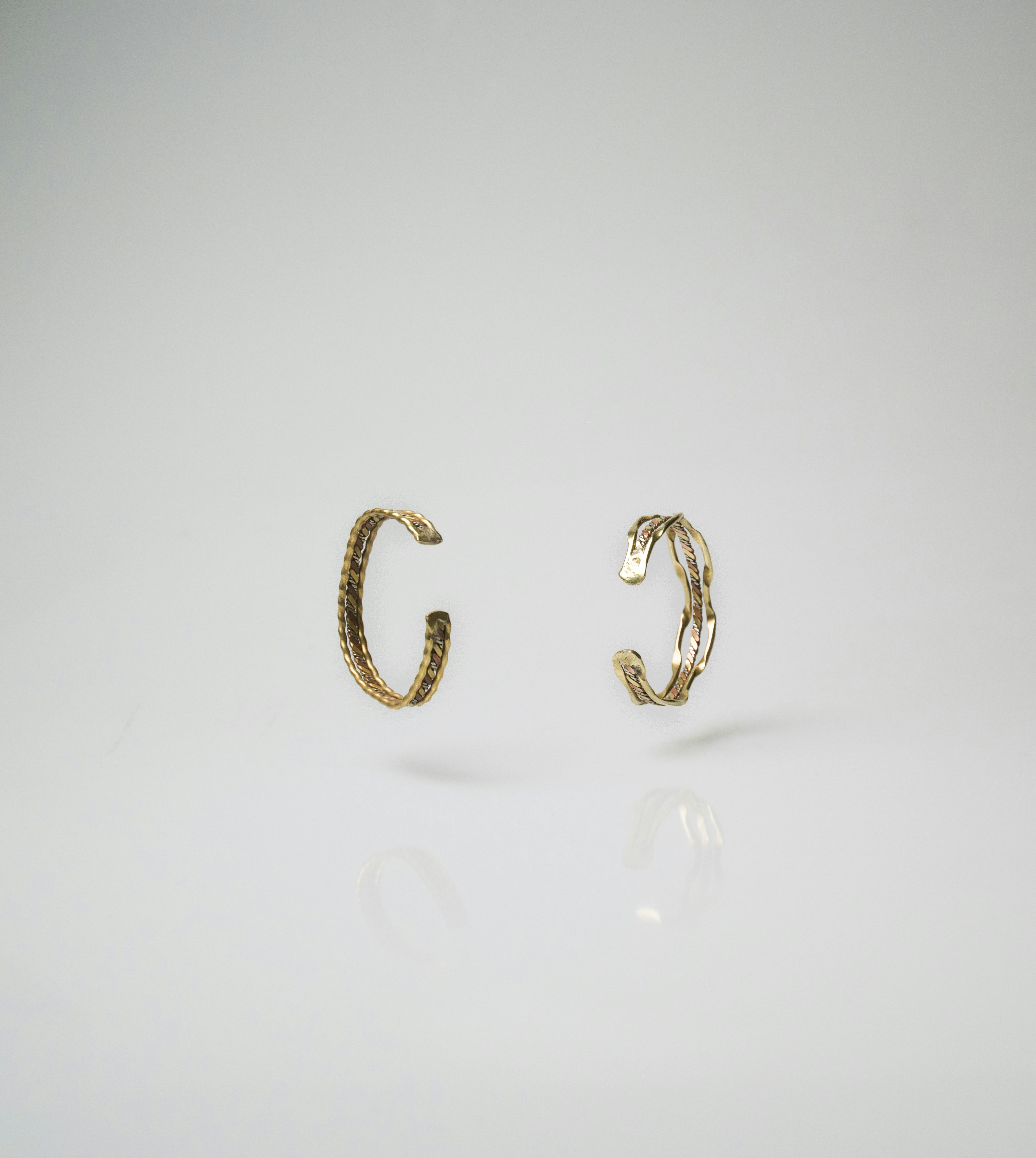 pair of gold-colored earrings