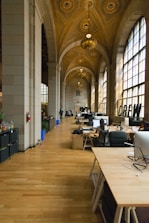 French HR manager reviewing training funding documents in a bright office with subtle French decor.