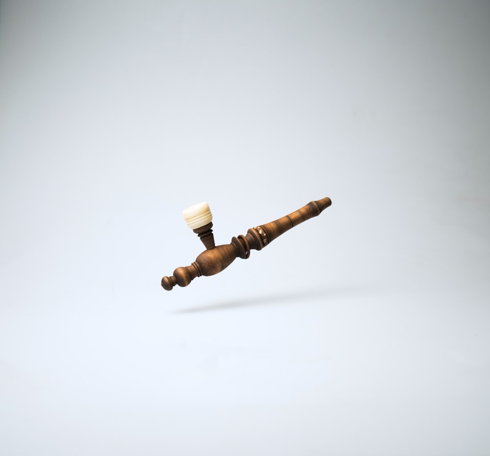 brown wooden smoking pipe