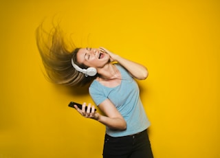 woman wearing white headphones