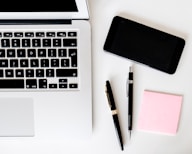 two pens near MacBook Air