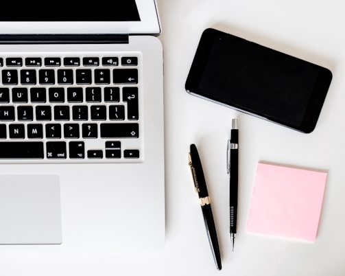 A vibrant flat lay of blogging tools and notes.