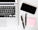 two pens near MacBook Air