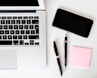 two pens near MacBook Air