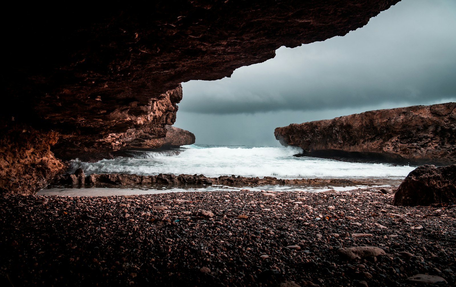 .7x Sigma DC 18-35/1.8 HSM sample photo. Shore under rock formation photography