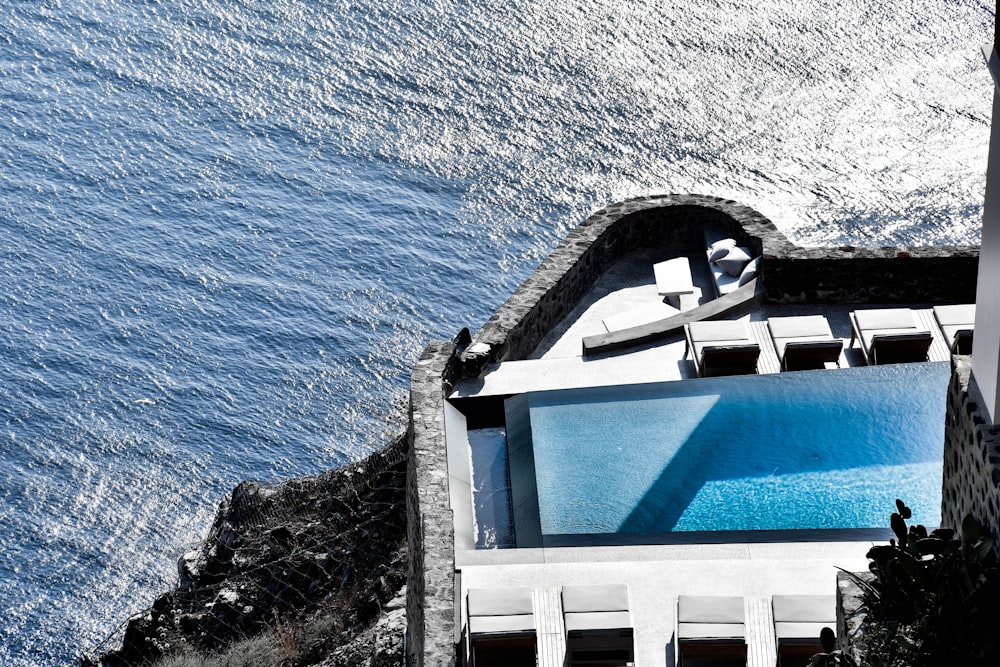 gray and white concrete building over body of water