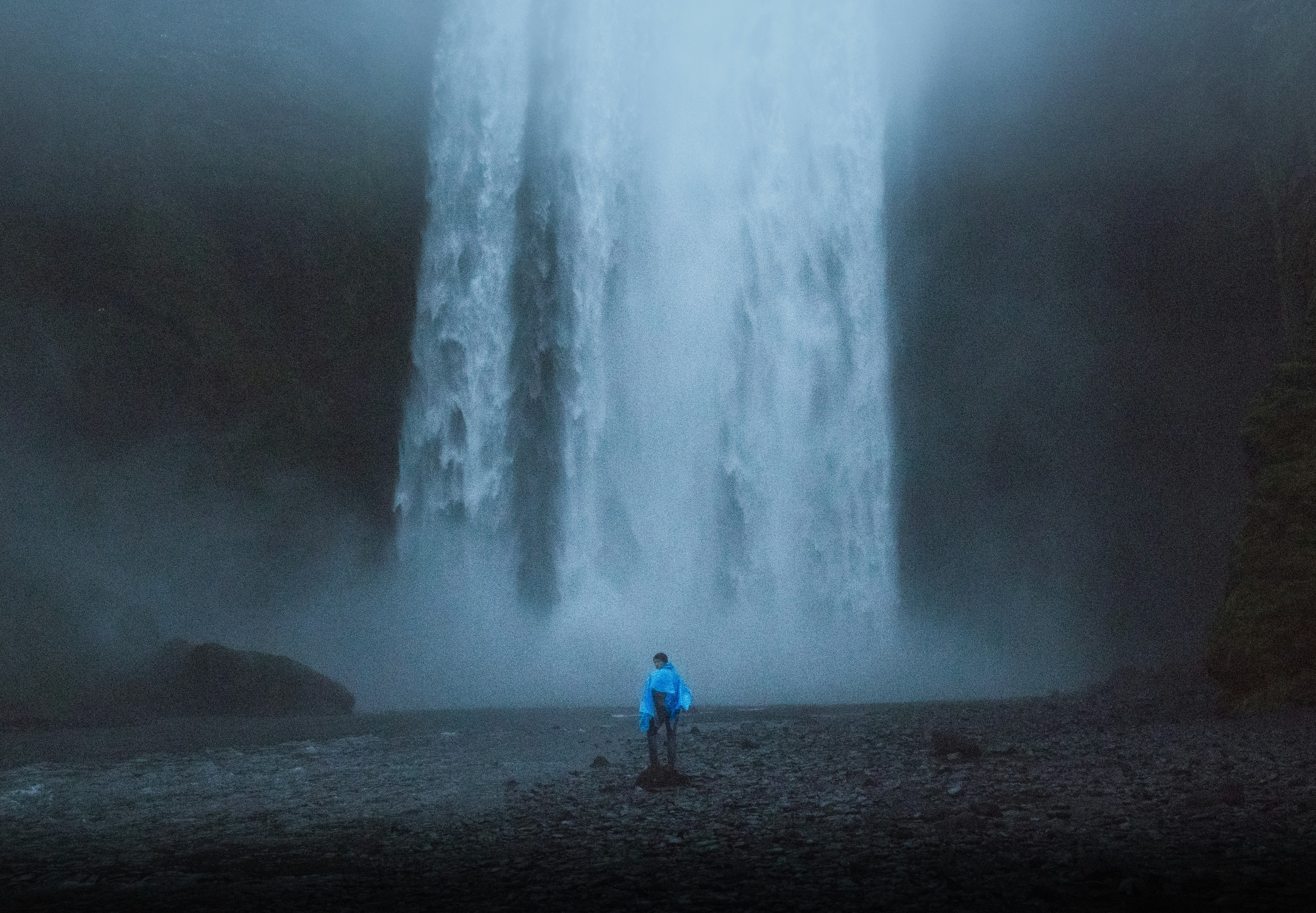 face standing in front of water falls