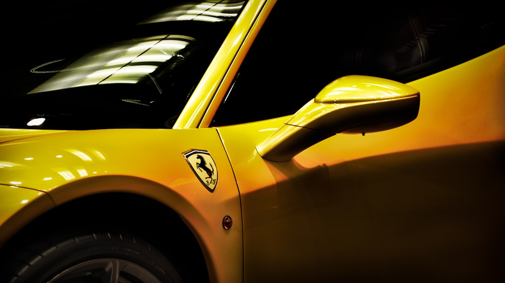 close shot of yellow Ferrari coupe