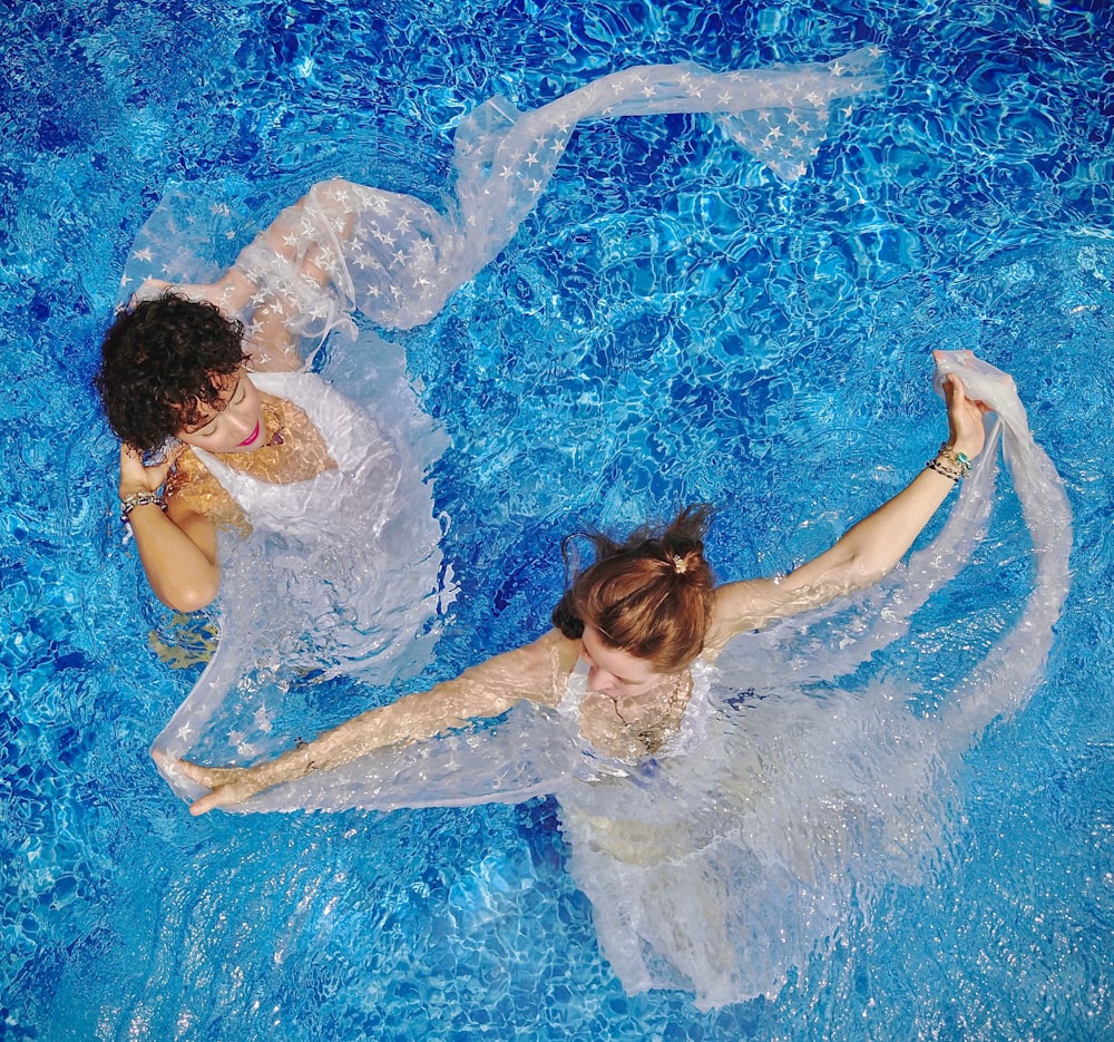 aerial view photography of two women on water during daytime