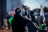 man carrying professional camera