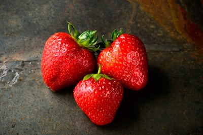 three red strawberries
