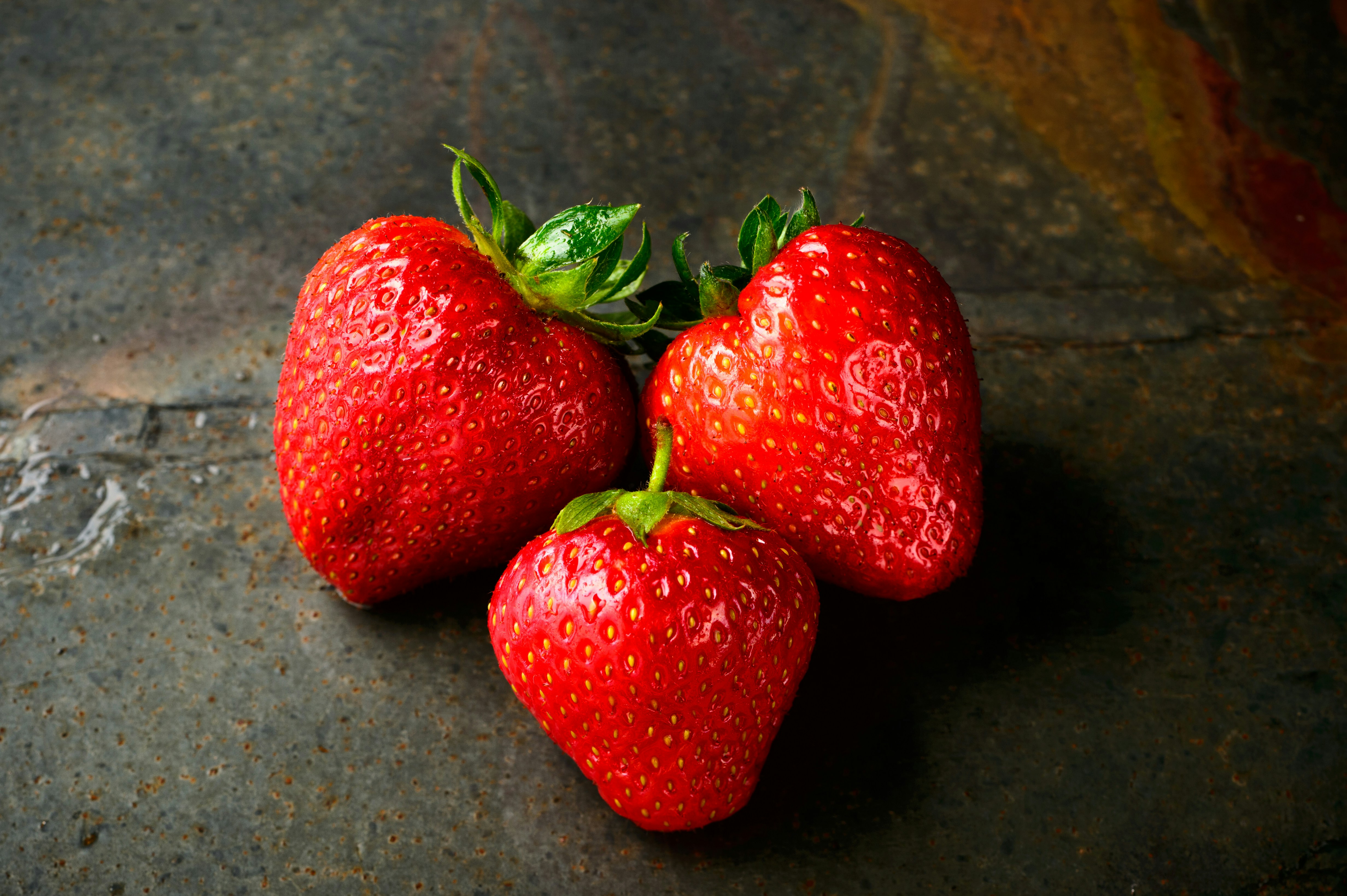 three red strawberries