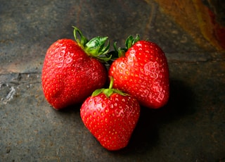 three red strawberries