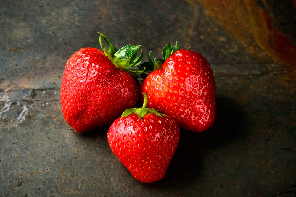 three red strawberries