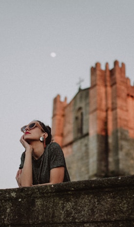 woman near stone castle