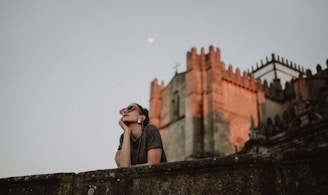 woman near stone castle