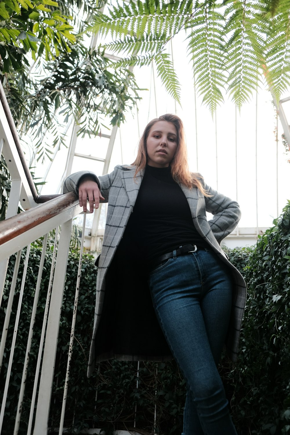 woman near green leafed plants