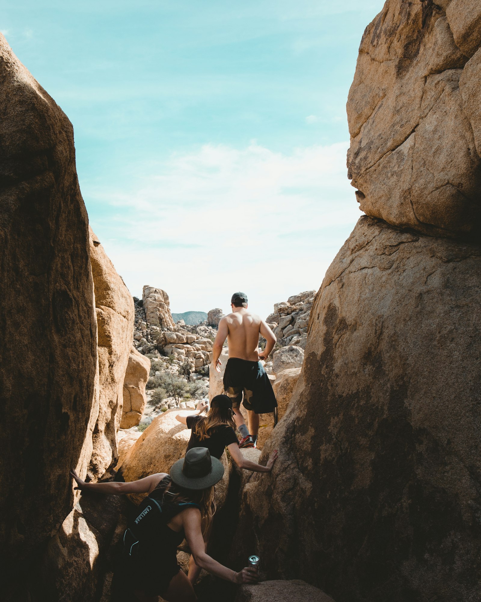 Canon EF 24-70mm F4L IS USM sample photo. People climbing on rocks photography