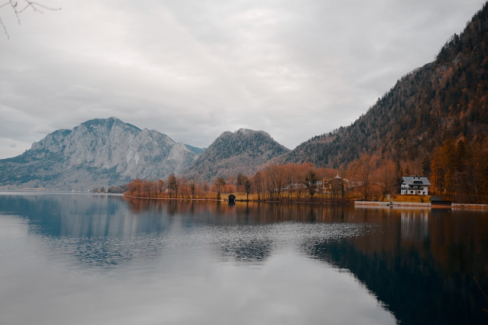 white painted house beside body of water