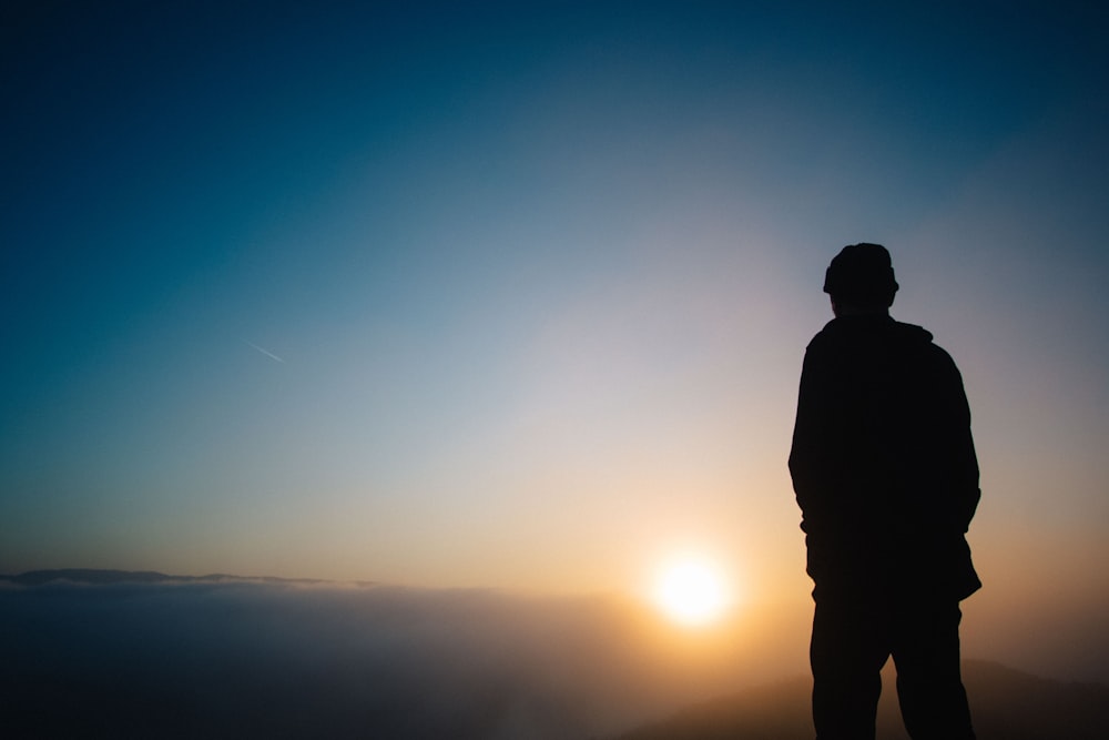 silhouette of a person during sunset