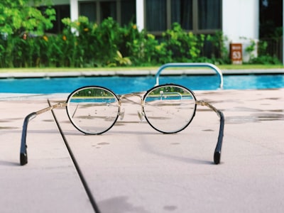 eyeglasses with black frames on white fabric distinct zoom background