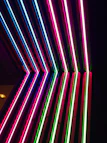 Dark neon-tech landing page layout with glowing mint and violet highlights