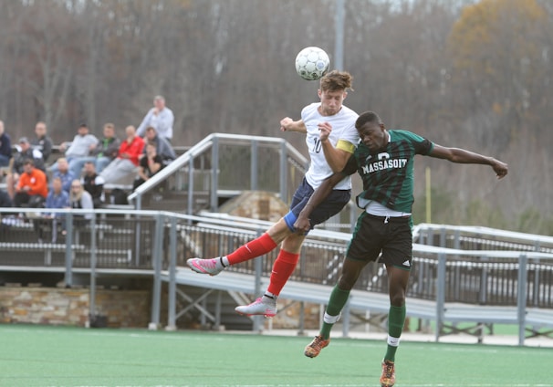 soccer players jumping