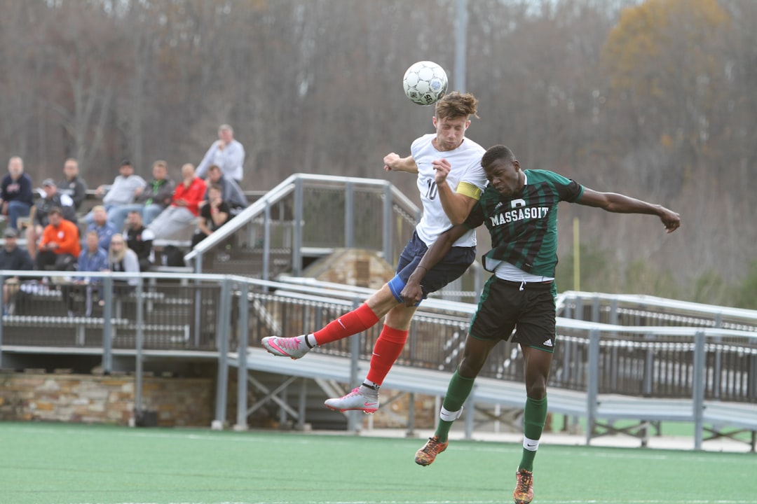 soccer players jumping, Header from a Louisburg player in the first game of the 2015 NJCAA D1 National Championship.