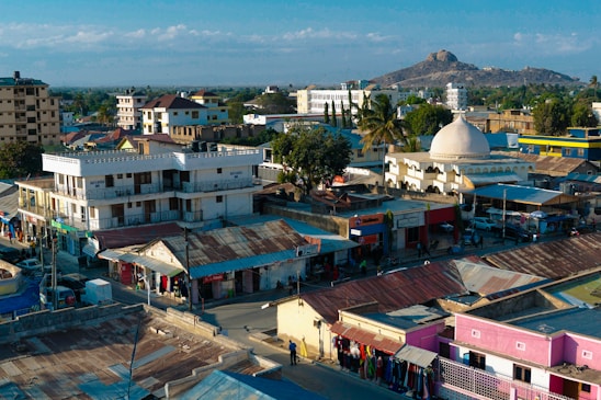 A vibrant photo of Cotabato City's city hall with locals engaging in community activities nearby.