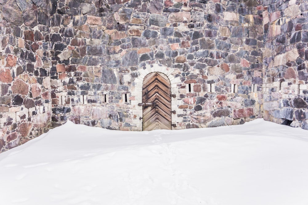 snow in front of wooden door