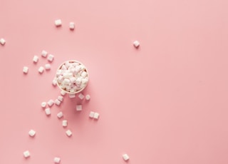 bunch of marshmallows on pink surface