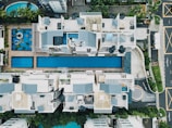 bird's eye view photo of pool between buildings