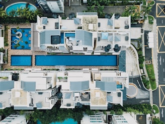 bird's eye view photo of pool between buildings