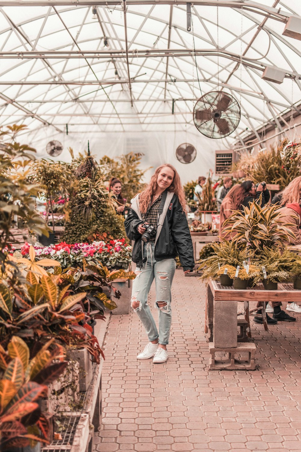 woman standing inside garden house