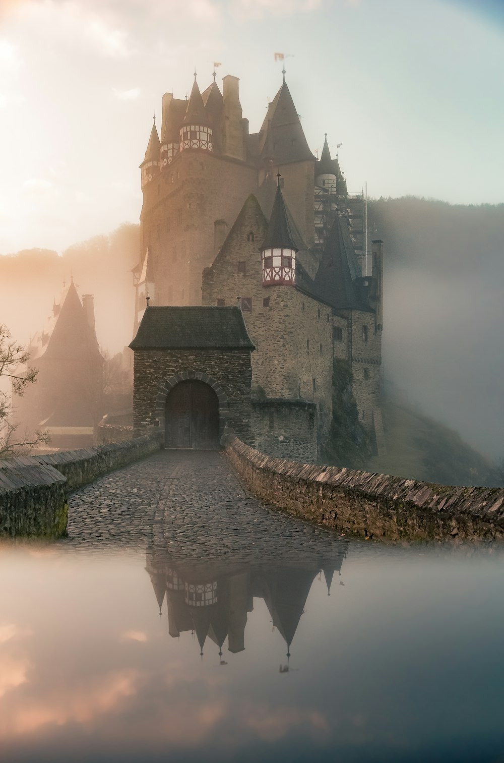 reflection of a castle surrounded with fogs