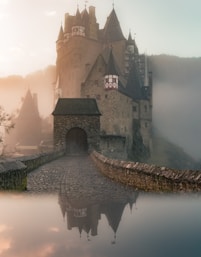 reflection of a castle surrounded with fogs