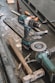 green Makita cordless drill near angle grinder