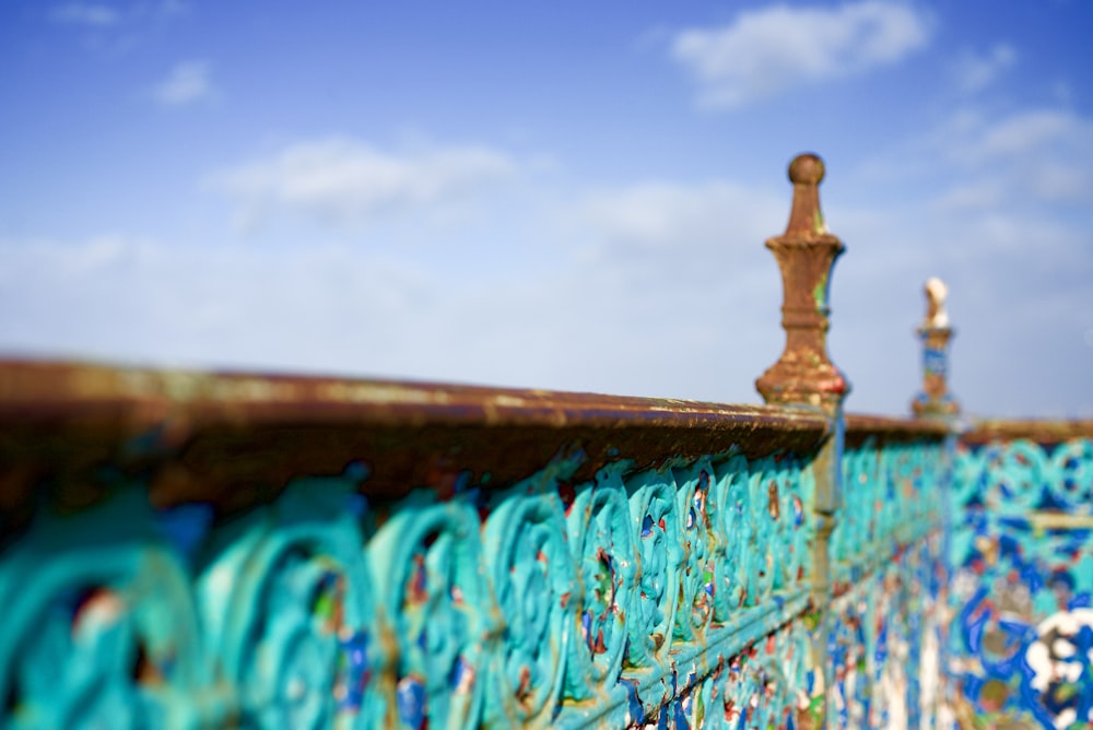 selective focus photo of brown metal pillar