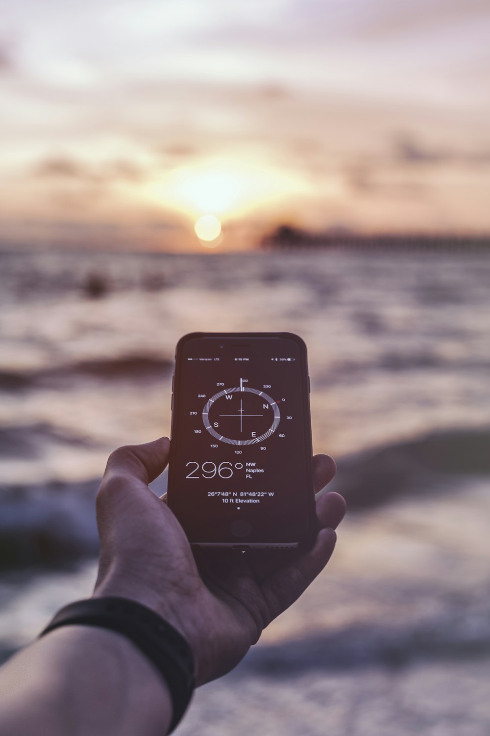 person holding smartphone reading at 296