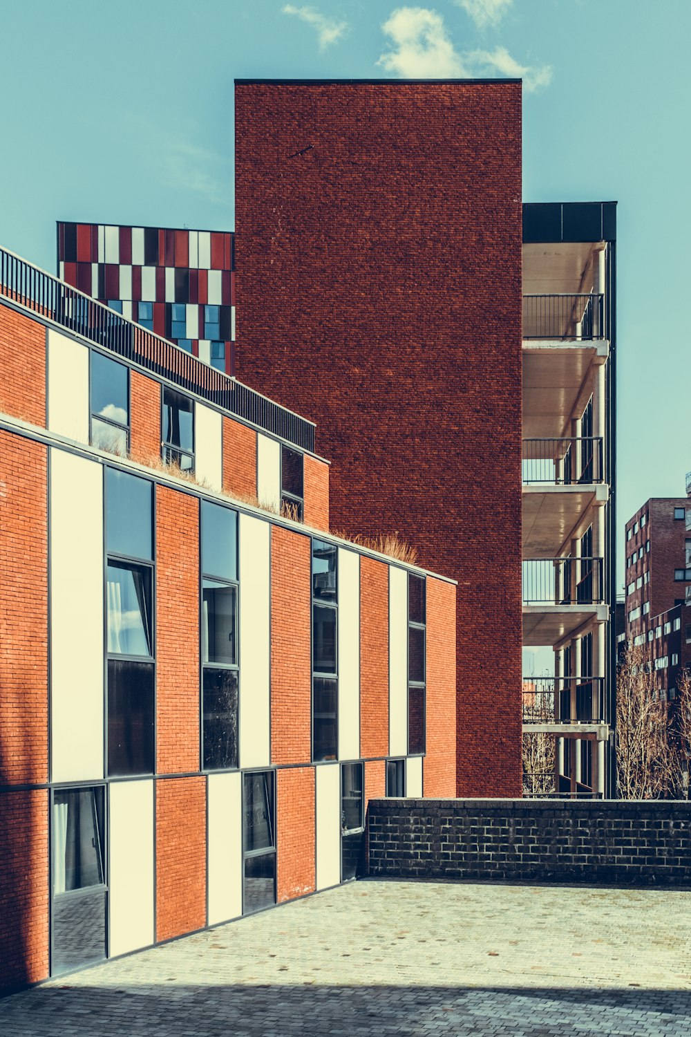 orange and white concrete building under blue sky at daytime