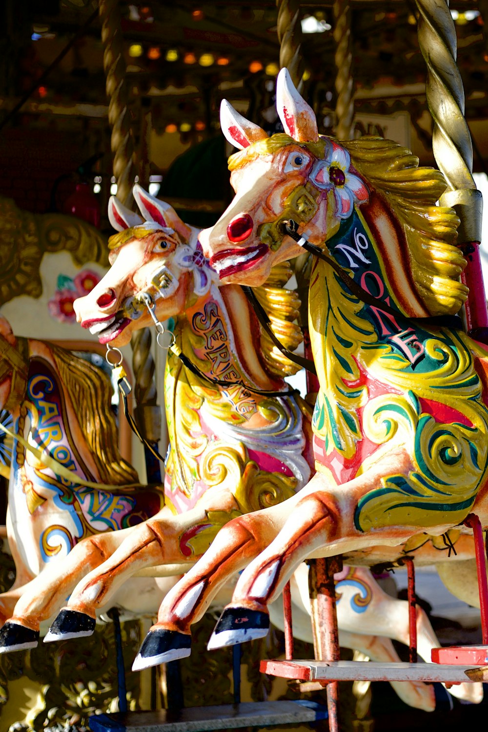 assorted-color carousel horses